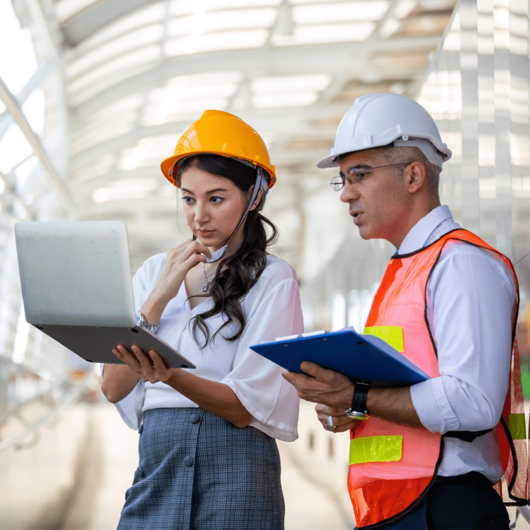 wind load calculator for Engineers Construction professionals discussing project on-site.